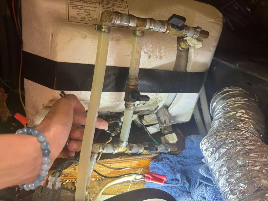 RV holding tank and piping repair underneath a fifth wheel