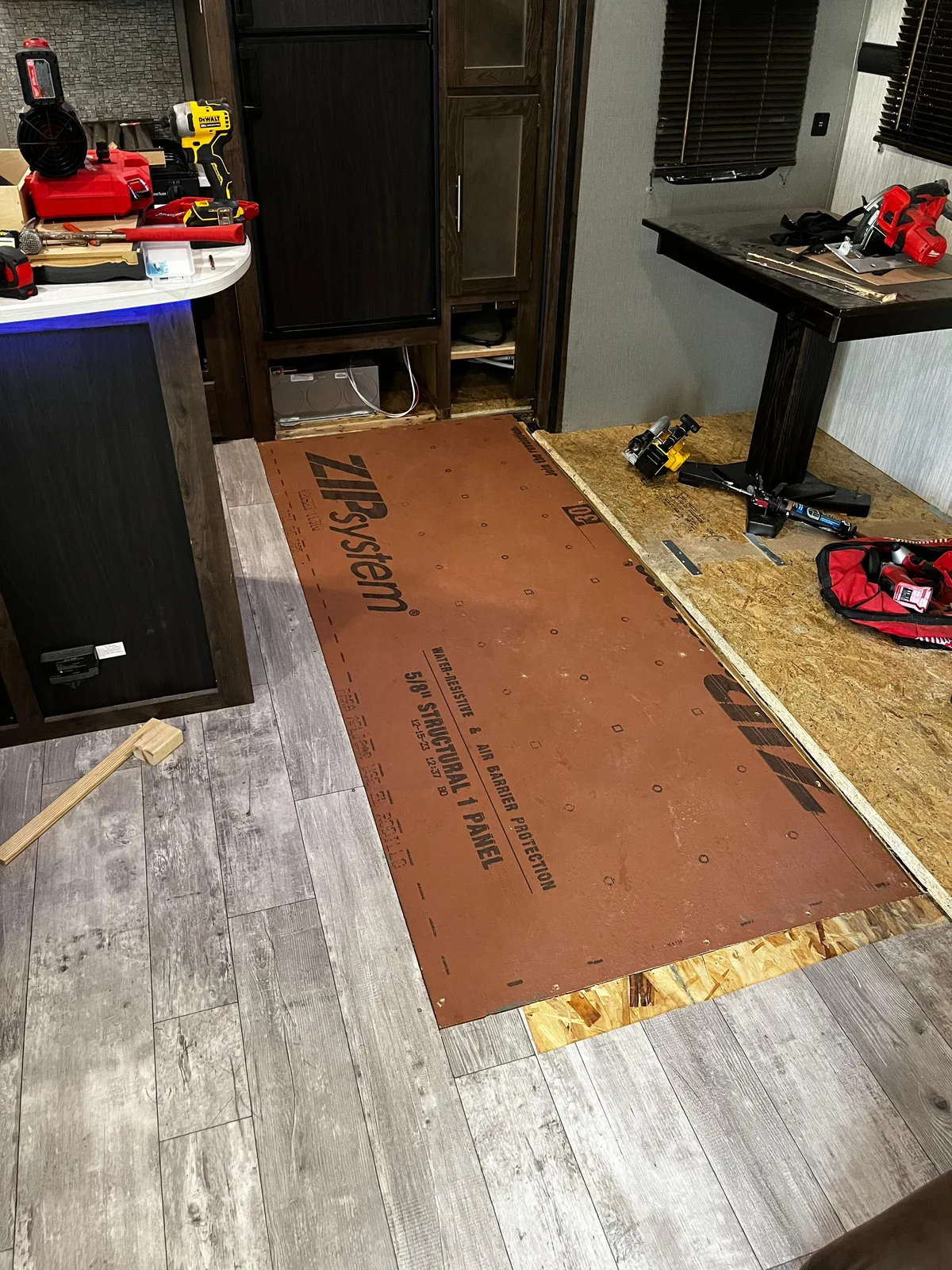 Bolt RV technician fixing the floor after a water leak inside an RV
